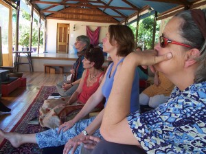 Listening to Shambhala Training talk by Acharya David Hope. Chris de Block (Assistant Director), Myrna Lewis, Jenny Birkett and Helen Douglas (left to right). Photo by Jennifer Woodhull.