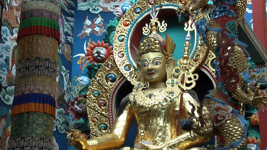 A 60-foot-high rupa of Padmasambhava is one of three huge gold statues that gaze down over the assembly of practitioners in the Golden Temple.