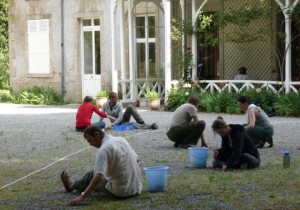 Weeding the gravel in front of the Chateau