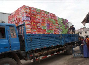 Truck full of supplies to distribute in Jyekundo, photo by Kontargyal