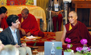 The Dalai Lama (R) smiles at Dr. Richard