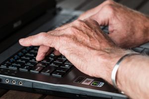 elder hands on keyboard